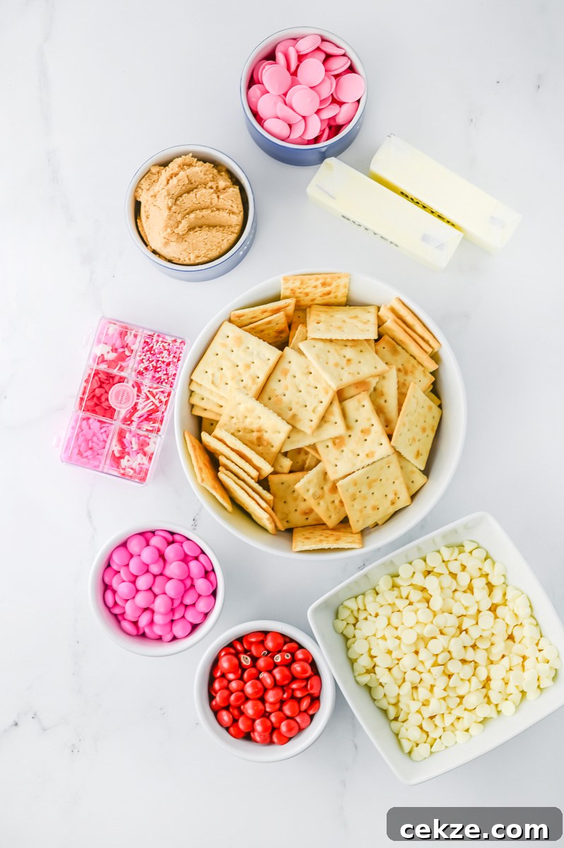 Ingredients for Valentine's cracker candy on kitchen counter laid out in small bowls.
