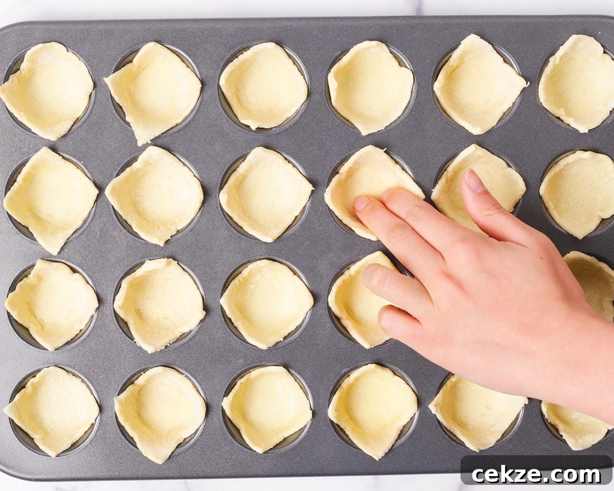 Cranberry Brie Bites: Mini Appetizers for Holidays & Parties 6 Assembled brie bites in pan