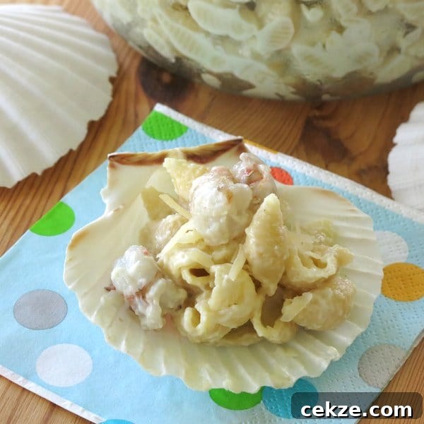 Fancy Gourmet Mac and Cheese with Shrimp on a clam shell