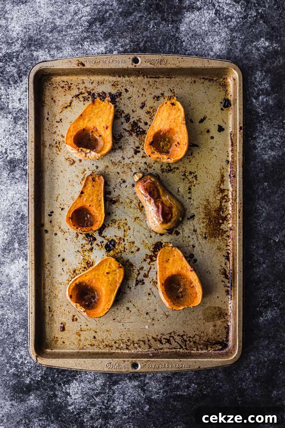 overhead shot of roasted butternut squash on a baking sheet to be used in the farmers market salad