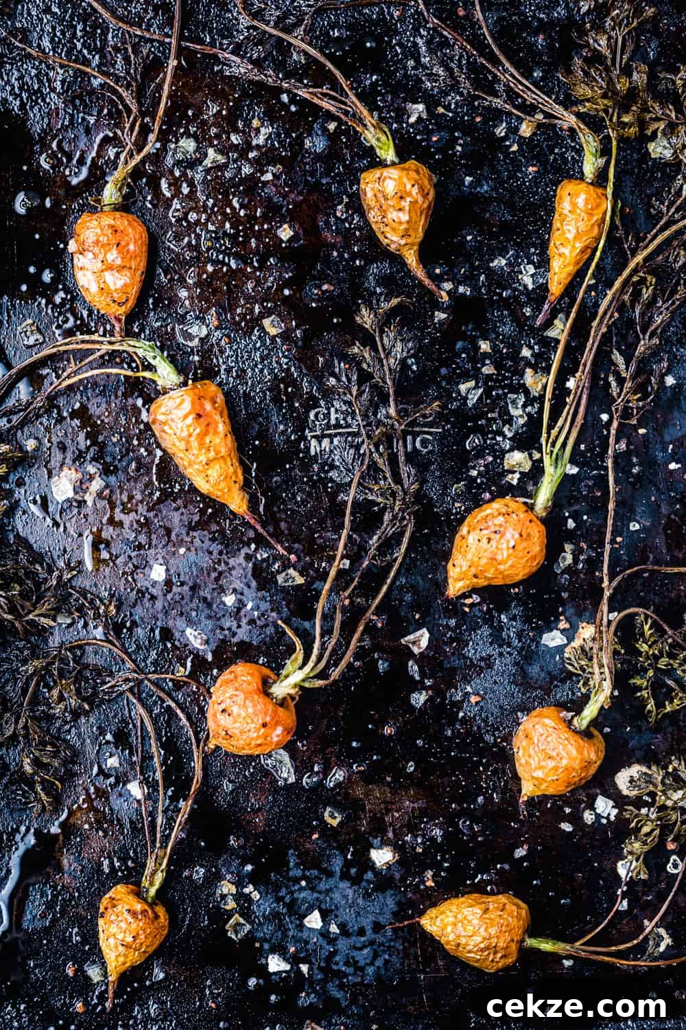 roasted baby carrots, just out of the oven, overhead shot to be used in the farmers market salad