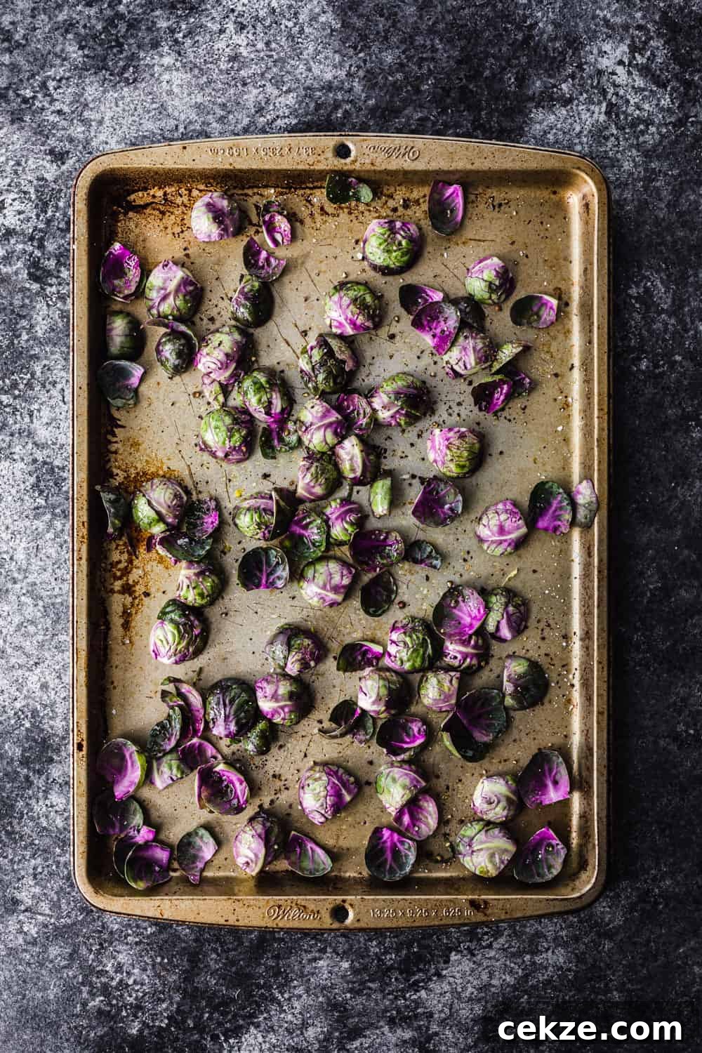 brussels sprout all arranged cut side down on a baking sheet to be used in the farmers market salad