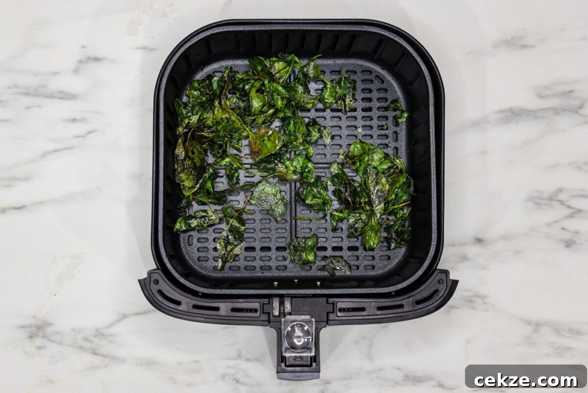 spinach chips in air fryer basket