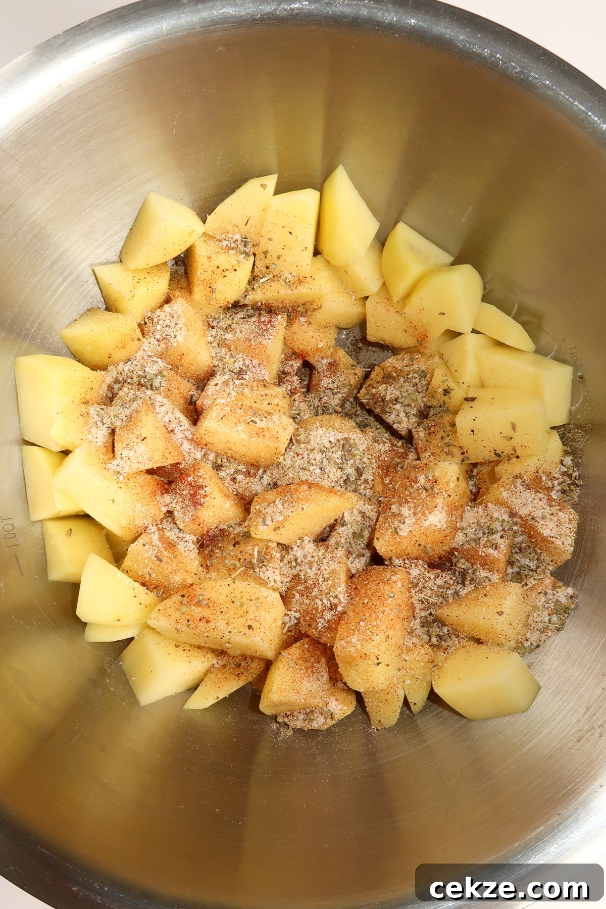 Garlic Butter Steak and Potatoes Skillet Recipe for Weeknights 5 potatoes with seasoning mix sprinkled on top