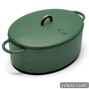 A green oval casserole with handles, perfect for Tuscan chicken mac and cheese.