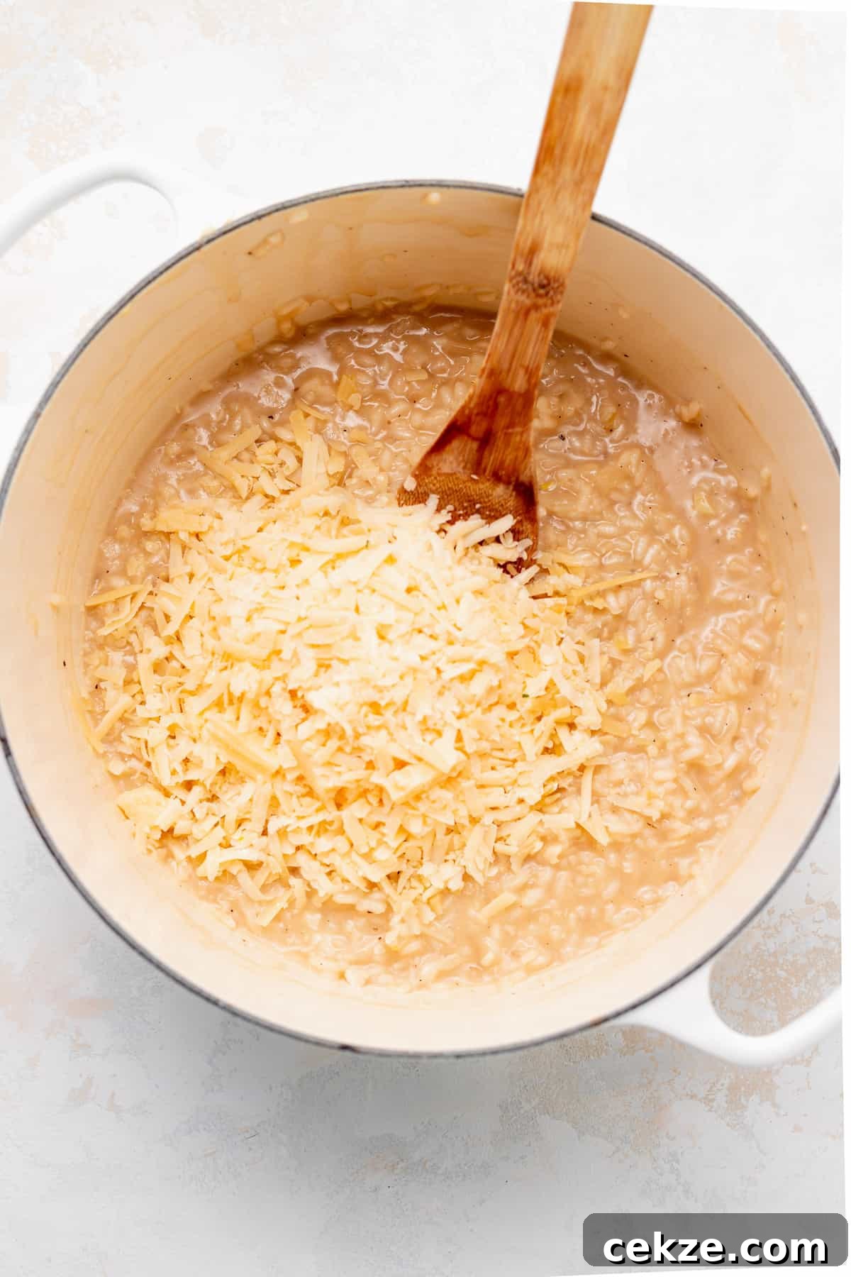 Cooking parmesan risotto in Dutch oven.