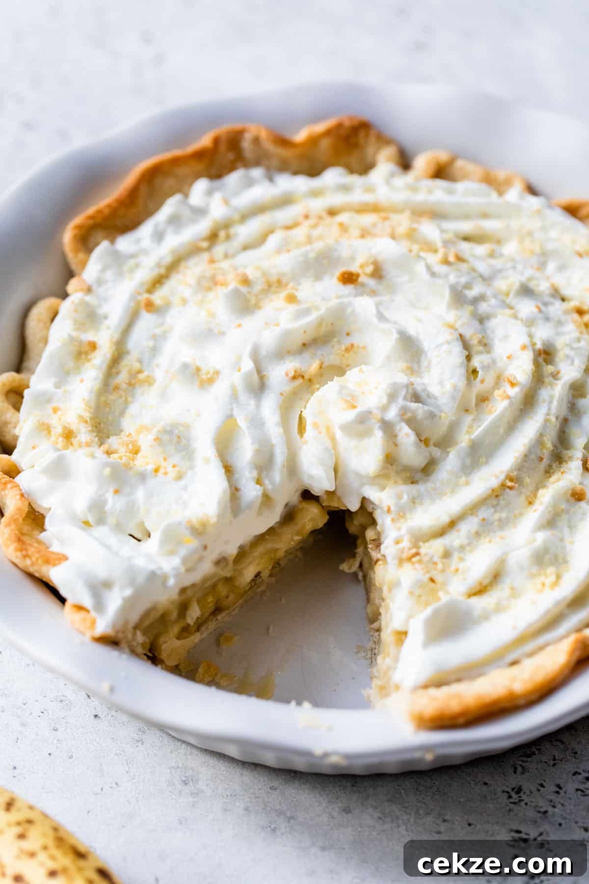 Creamy Banana Pudding Pie Recipe: Step-by-Step Dessert Guide 5 banana pudding pie with a slice taken out