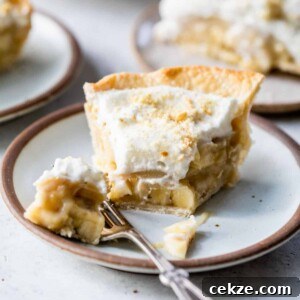 Creamy Banana Pudding Pie Recipe: Step-by-Step Dessert Guide 7 slice of banana pudding pie on a plate with a fork and a bite taken out