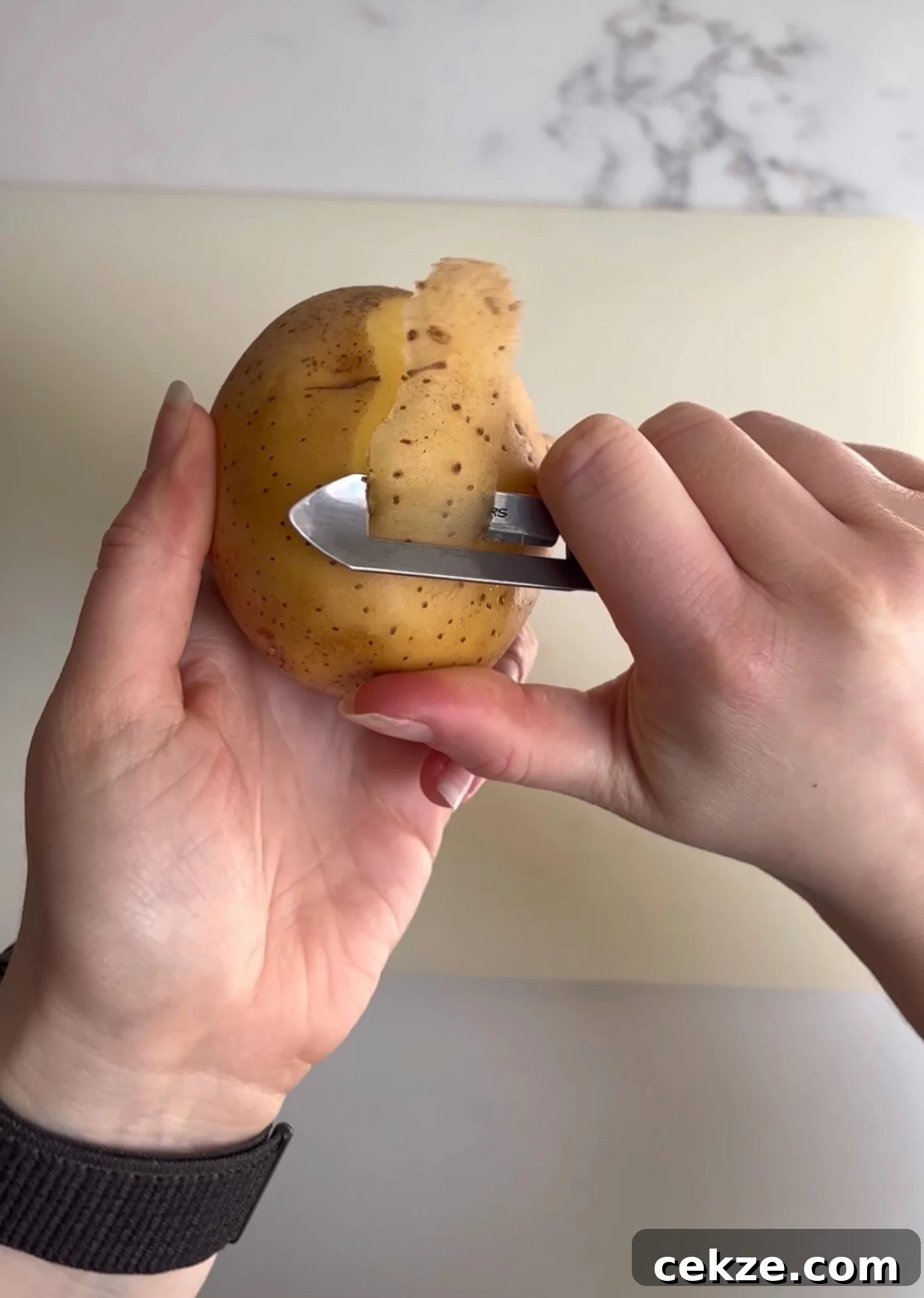 Peeling potatoes.