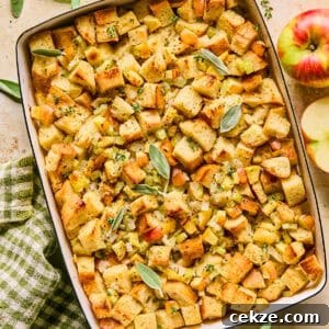 Apple and Sage Stuffing Recipe with Crispy Herbs 15 Pan with apple stuffing topped with herbs.