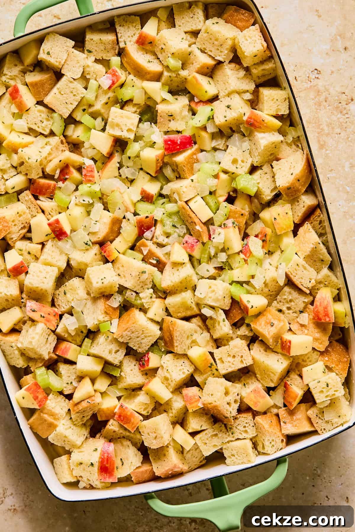 Apple and Sage Stuffing Recipe with Crispy Herbs 10 Stuffing before being baked in pan.