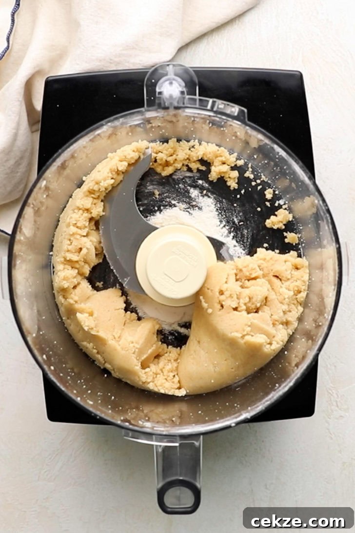 Top down view of crumb topping being made in a food processor.