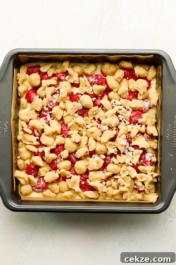 Brown sugar crumb topping placed over lemon raspberries bars before baking.