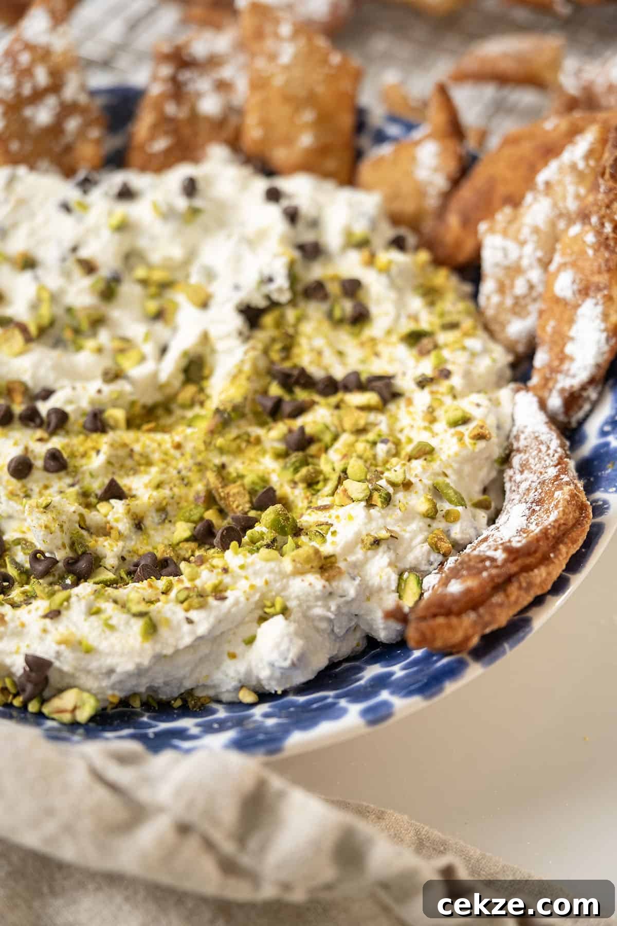 Authentic Cannoli Dip with Homemade Cannoli Chips 2 Homemade cannoli dip and chips in a dish.