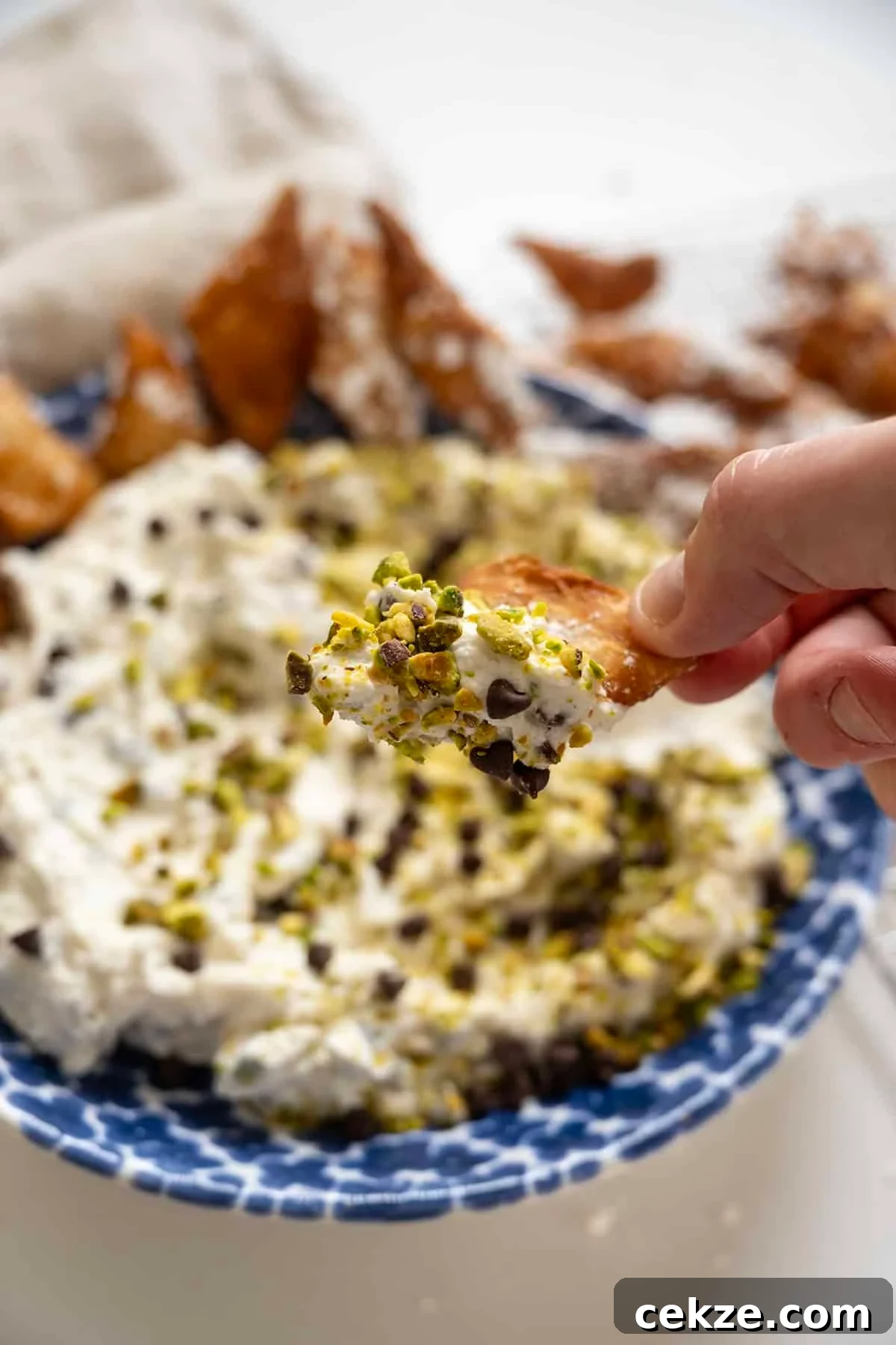 Authentic Cannoli Dip with Homemade Cannoli Chips 15 Homemade cannoli dip and chips in a dish.
