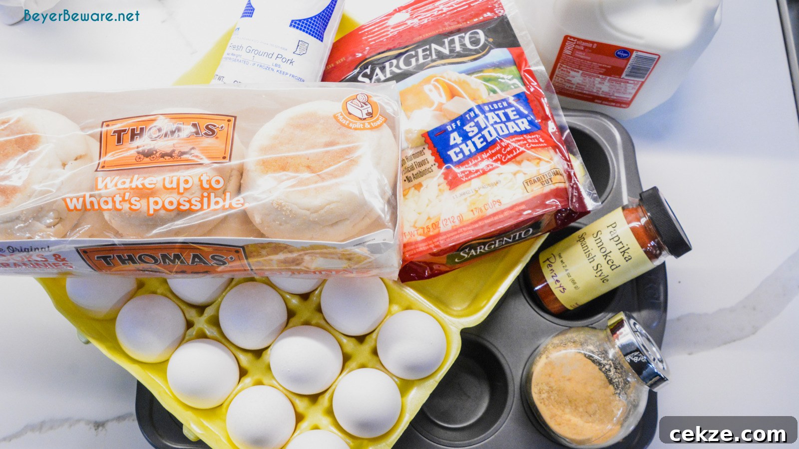 English Muffin Egg Cups are individual egg casseroles made from combining cubed English muffins, breakfast sausage, eggs, and cheese and then ready to eat, freezer, or fridge for quick breakfasts all week long.