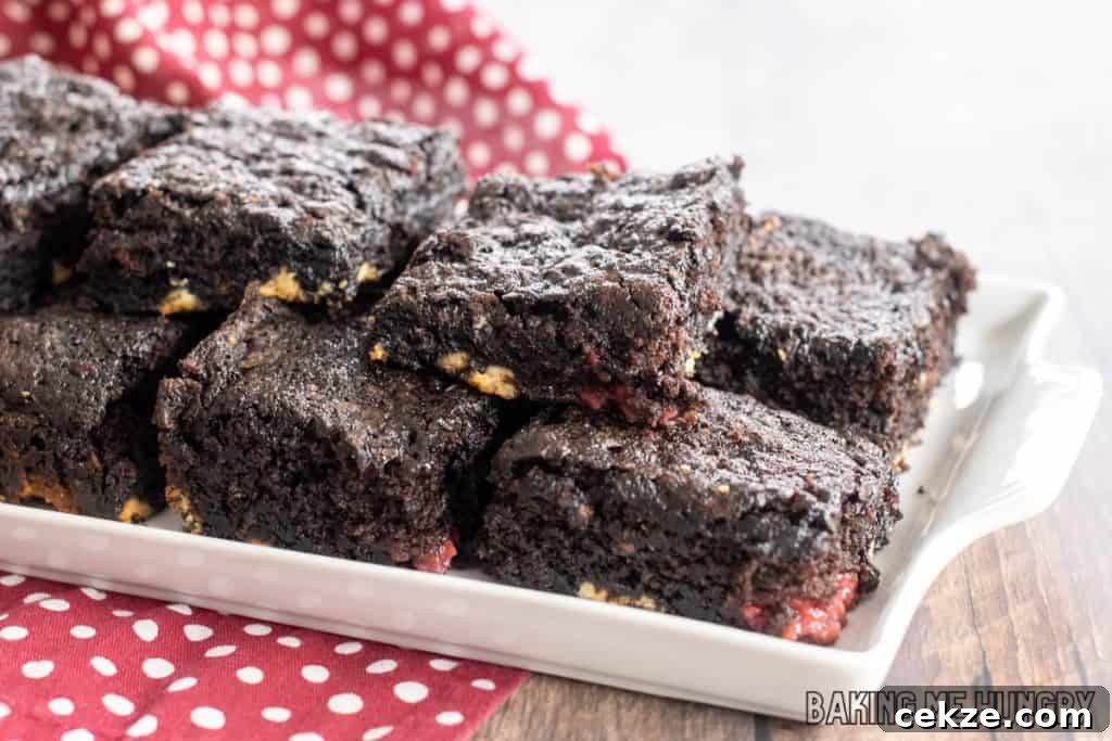 white chocolate raspberry brownies on a white plate