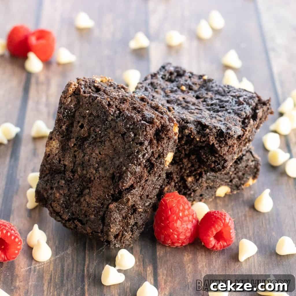 white chocolate raspberry brownies recipe in a stack with one on its side