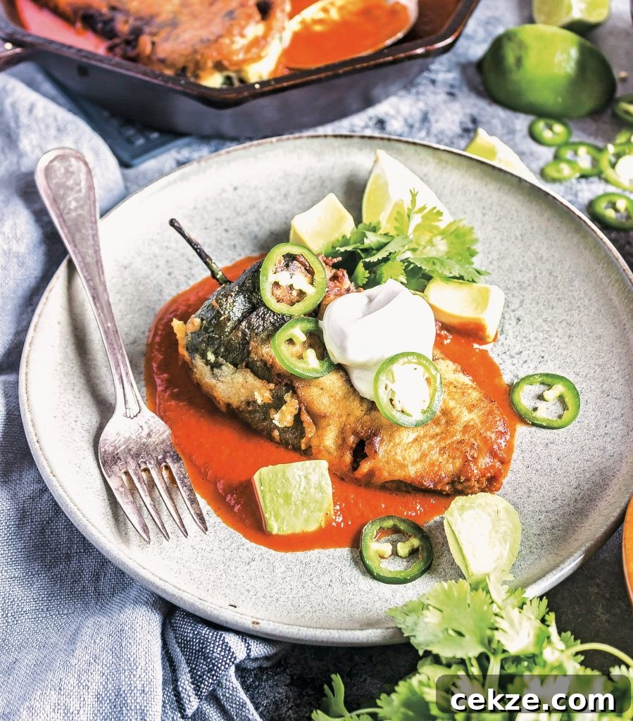 Keto Chile Rellenos on a plate with sauce