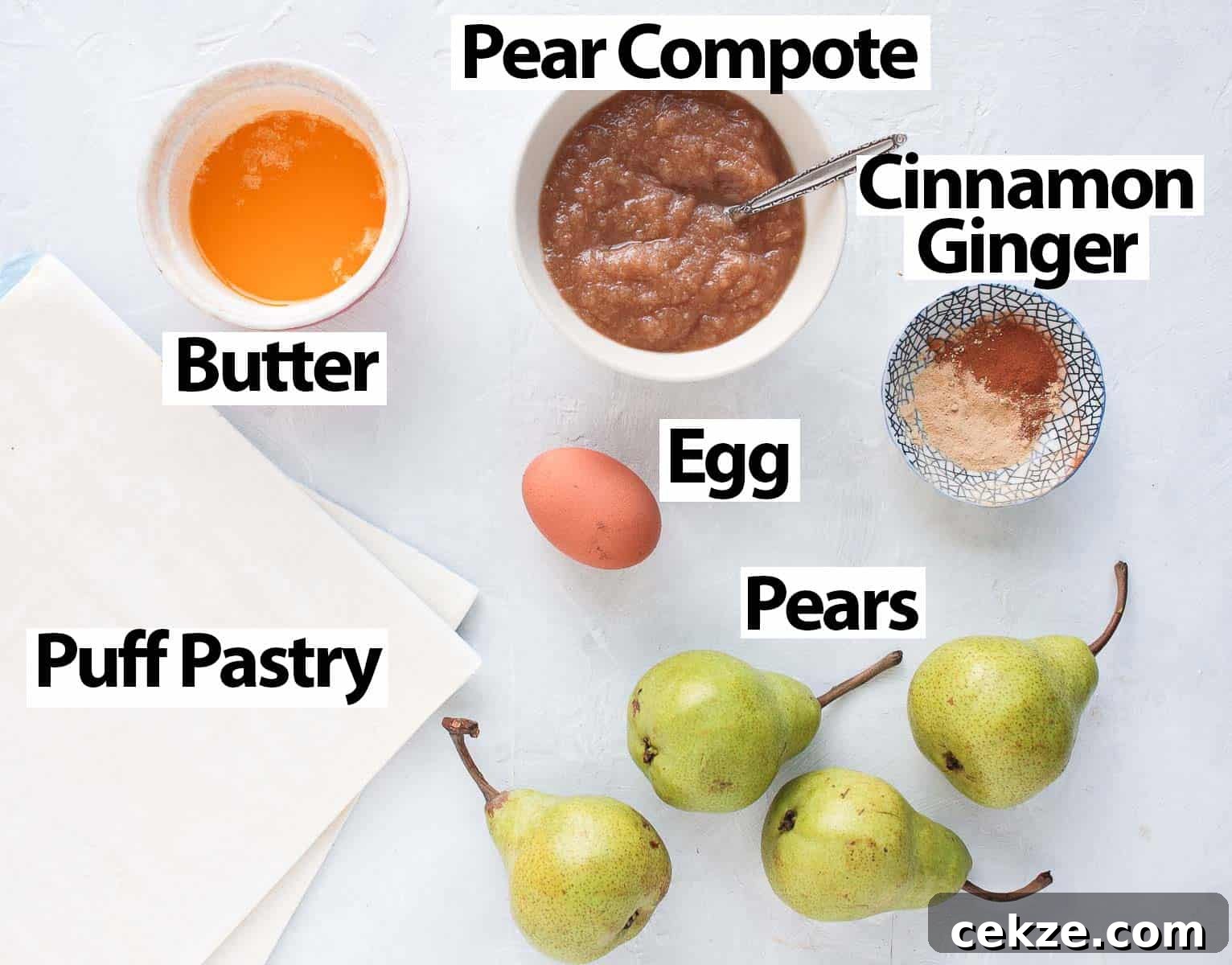 Puff Pastry Pear Tartlets with Honey and Almonds 3 Ingredients on a white surface.
