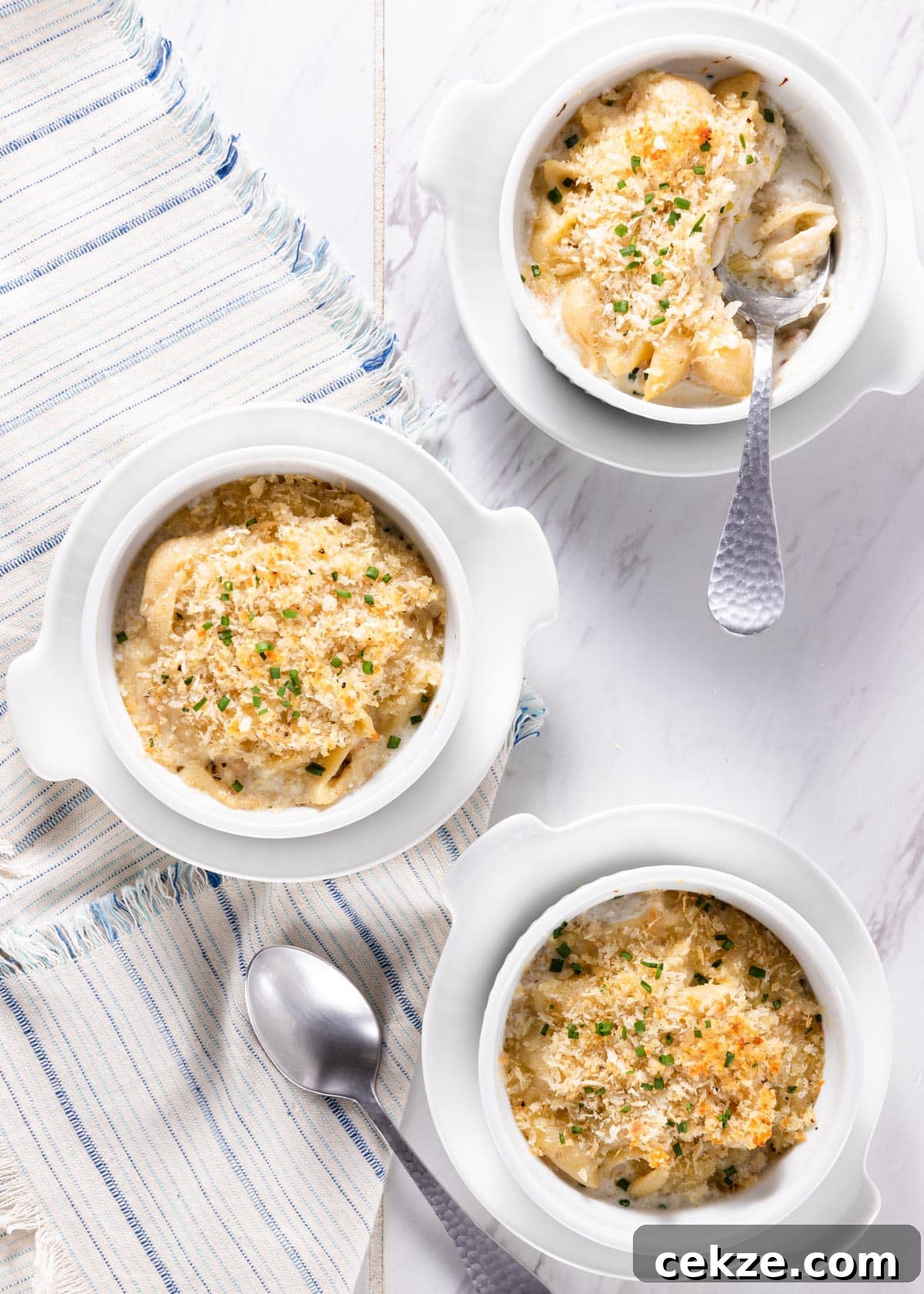 overhead of baked gorgonzola and fontina macaroni and cheese served in ramekins