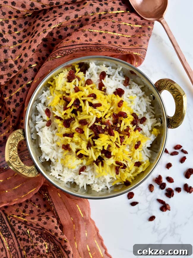 Instant Pot Zereshk Polo — Persian Barberry Rice Recipe 2 Instant pot barberry rice in copper bowl with golf scarf and copper spoon.