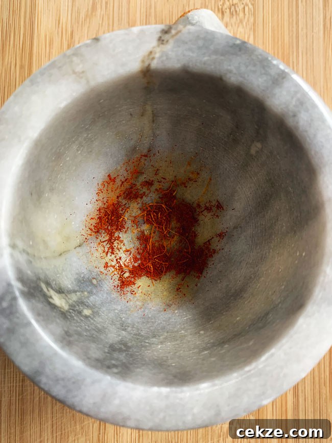 Instant Pot Zereshk Polo — Persian Barberry Rice Recipe 10 Saffron smashed in mortar and pestle.