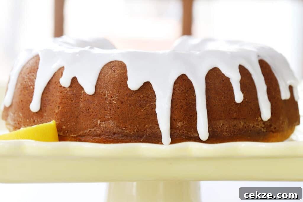 Lemon poppy seed cake recipe on a yellow platter.
