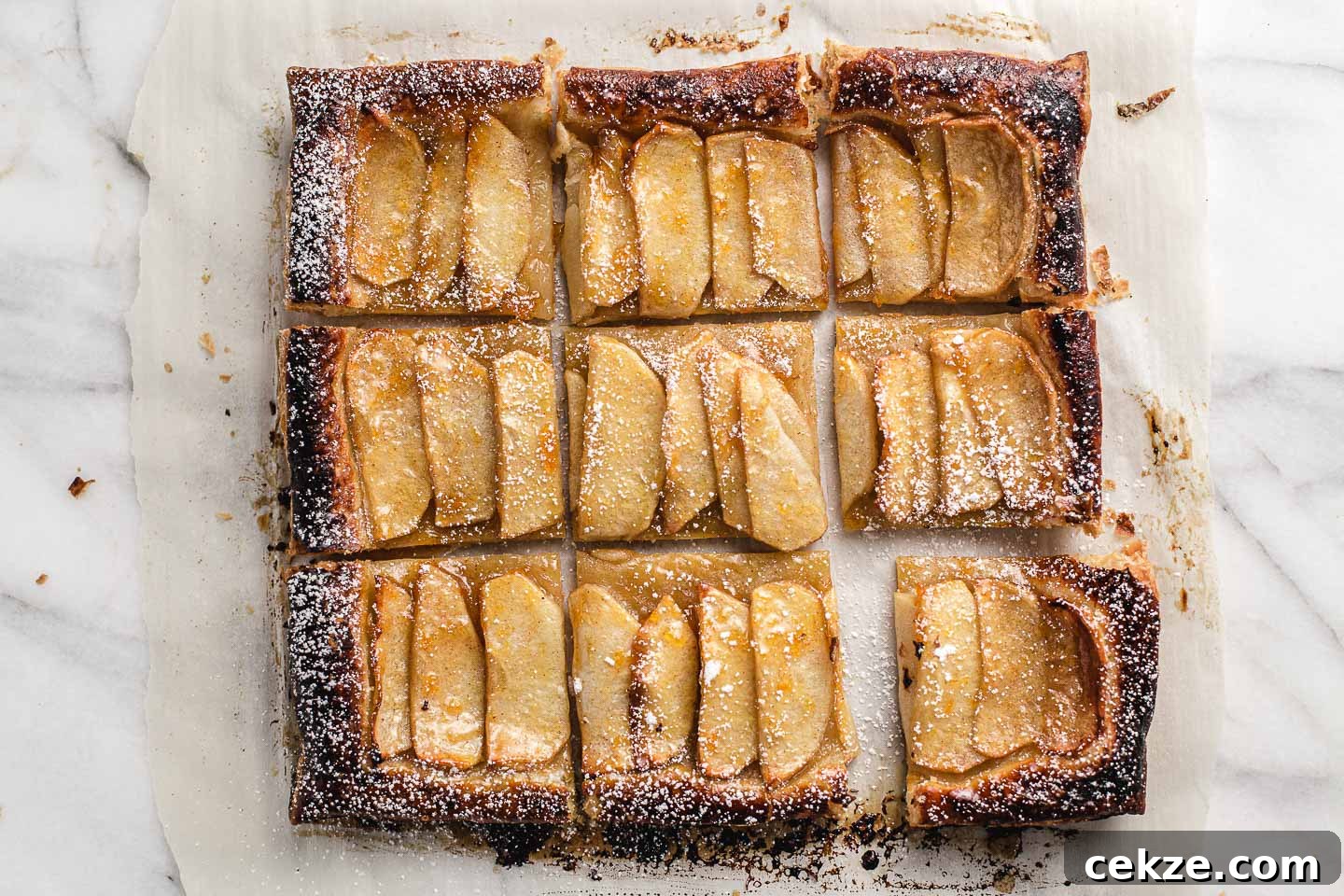 Rustic Apple Tart Recipe: Flaky Crust and Caramelized Apples 6 Apple tart cut into nine squares.