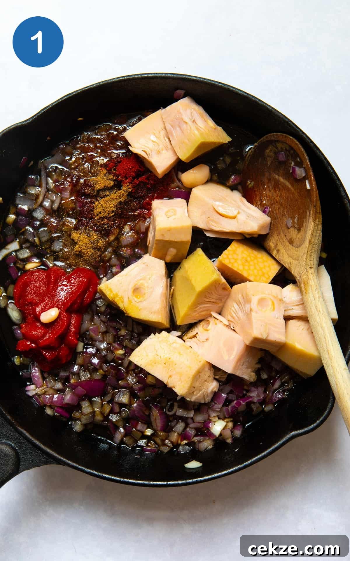 red onion, garlic and jackfruit in a pan.