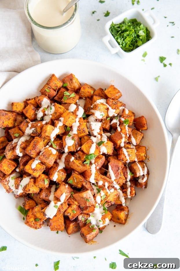 25 Must-Try Recipes from 2020: Top Fan Favorites 27 overhead shot of the best roasted sweet potatoes drizzled with tahini sauce