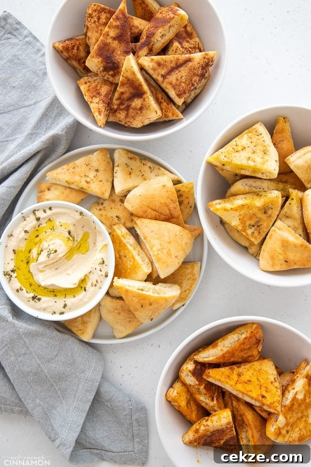 25 Must-Try Recipes from 2020: Top Fan Favorites 10 overhead shot of 4 different flavors of homemade Stacey's Pita Chips with a small bowl of hummus