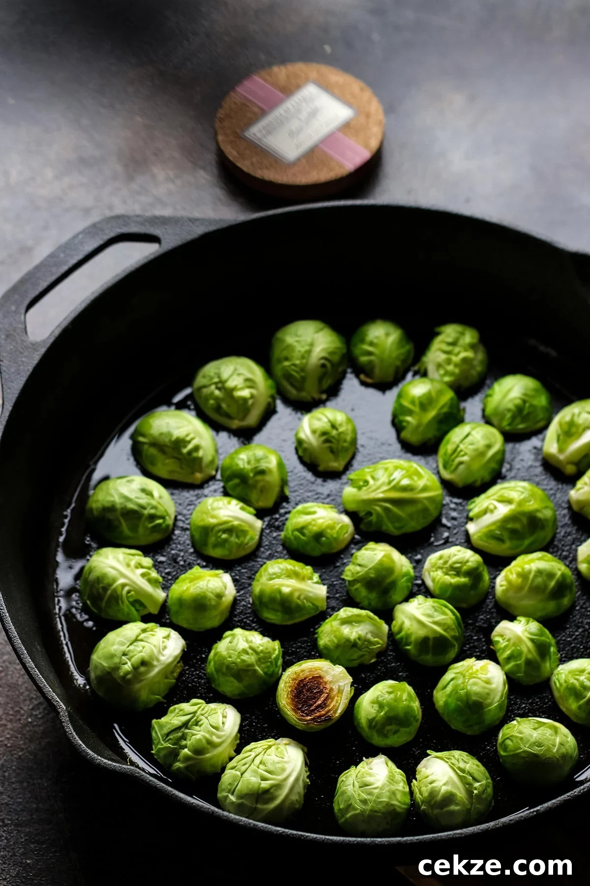 Brussels Sprouts in a Cast Iron Skillet Cut Side Down