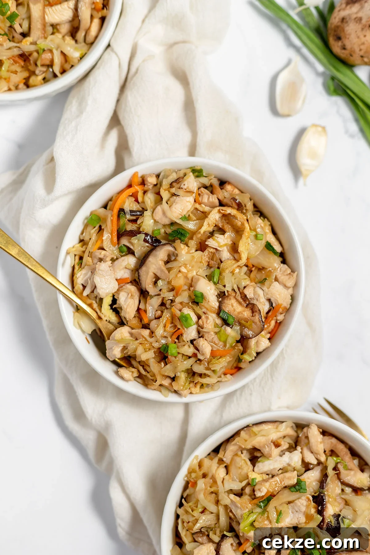 Moo Shu Chicken served in white bowls.