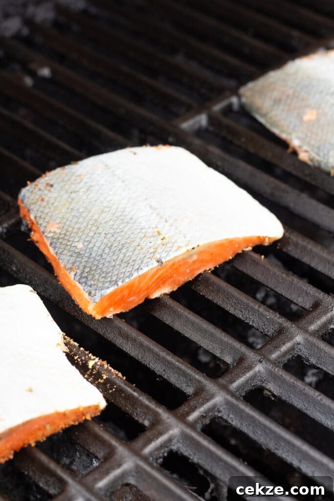 15-Minute Chili Lime Grilled Salmon Recipe 7 Close up of salmon filets on a grill, flesh side down.