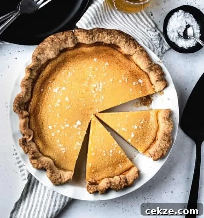 Overhead image of salted honey pie with slices cut from it