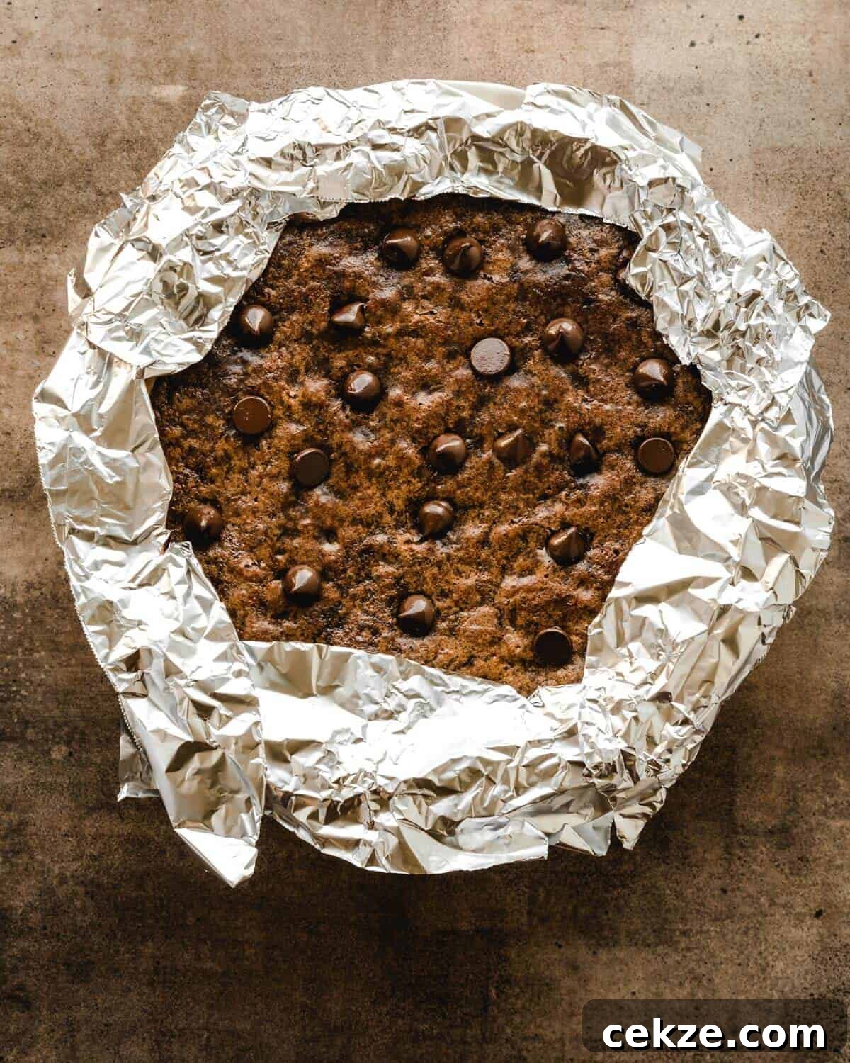 Ultimate Chocolate Chip Cookie Pie Recipe for Every Occasion 7 Aluminum foil covering the edges of the pie so they don't burn.