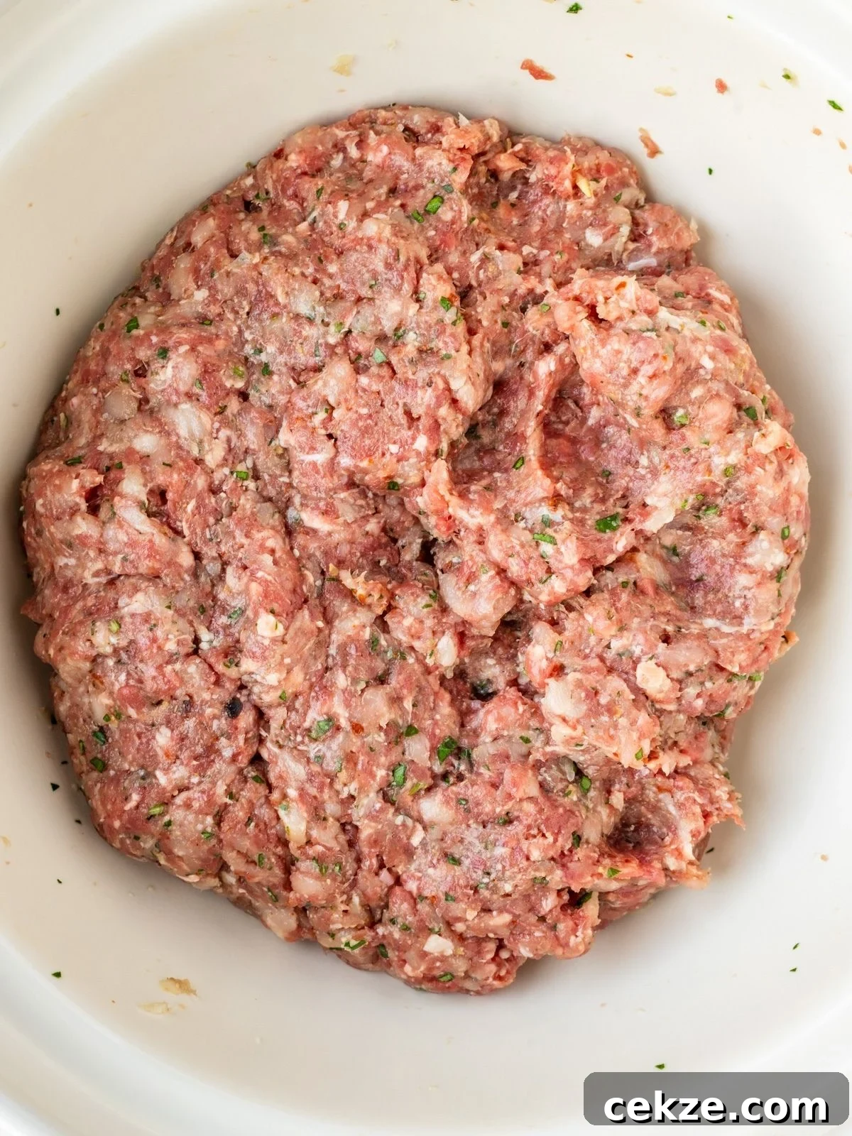 Juicy Italian Meatballs Without Breadcrumbs — Recipe & Tips 5 Bowl with ground meat mixture.