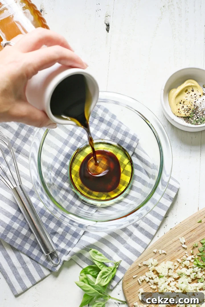 woman making marinade for bruschetta chicken