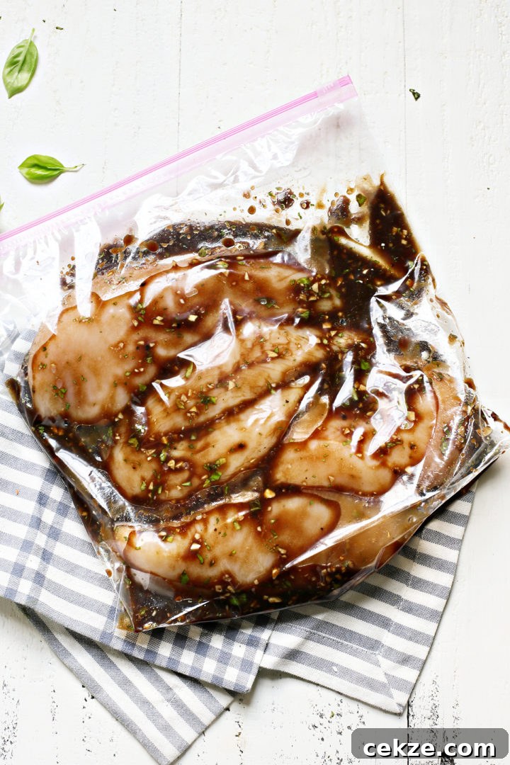 chicken breasts in a plastic bag with bruschetta chicken marinade
