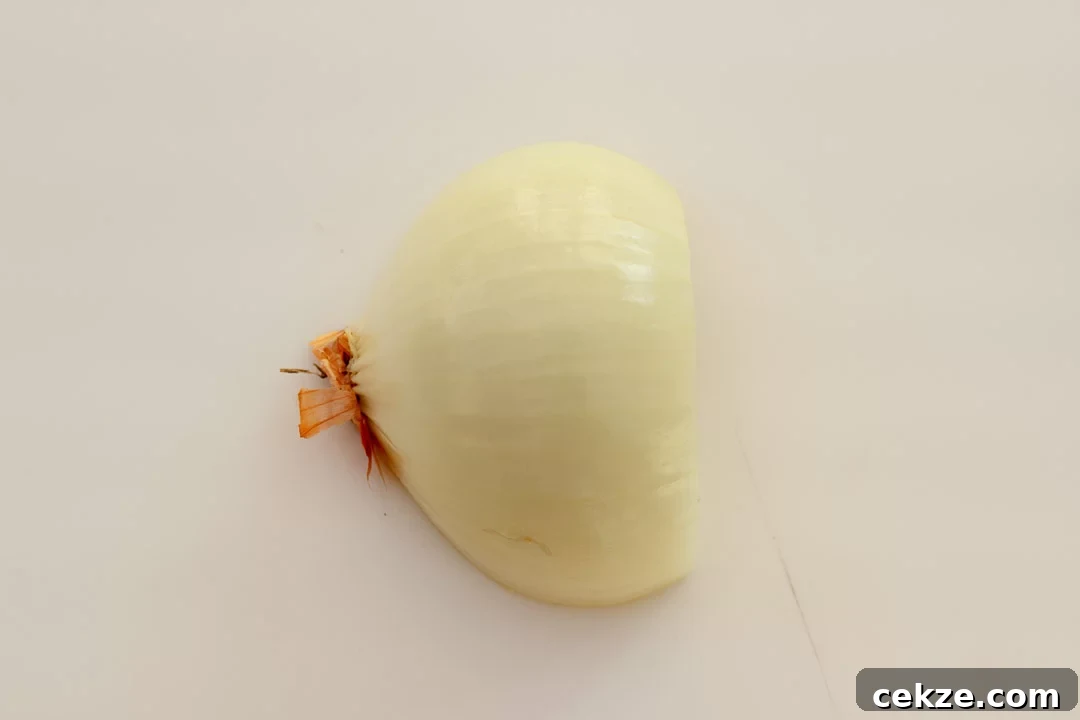 A halved, peeled onion