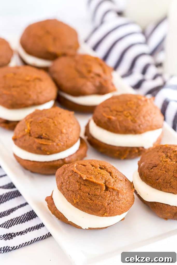 Eight homemade whoopie cookies on a white dish