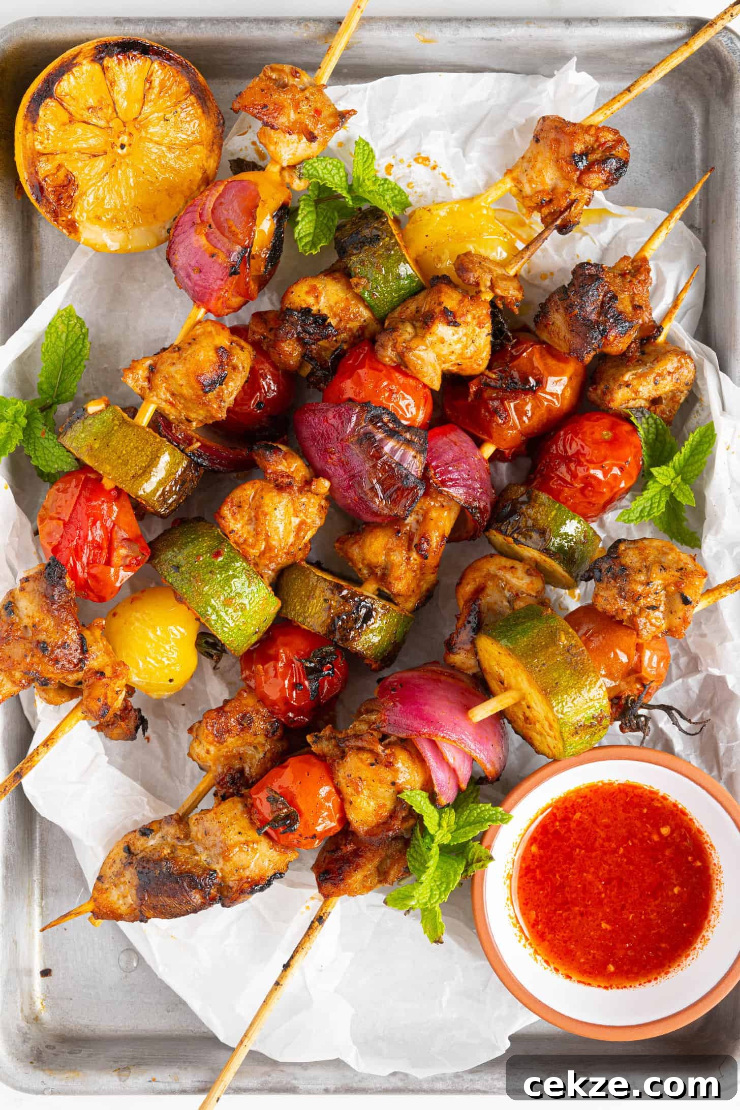 harissa chicken skewers on a pan