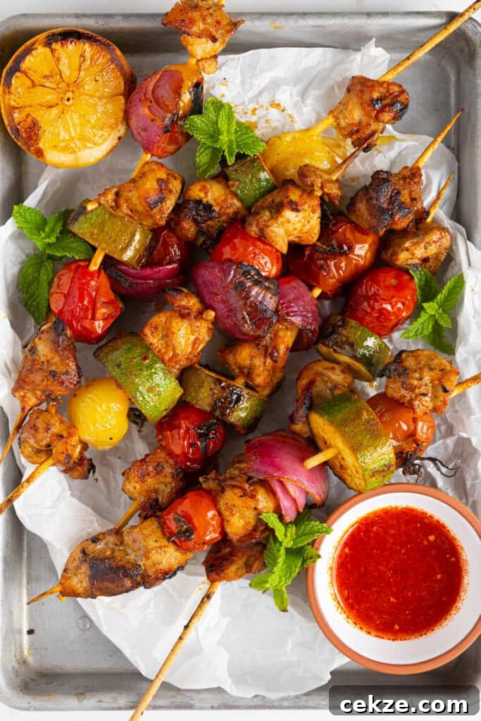 harissa chicken skewers on a pan