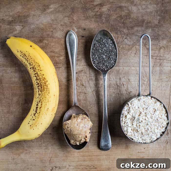 No-Cook Overnight Oats Recipe for Camping Breakfast 4 ingredients for overnight oats on a wooden table