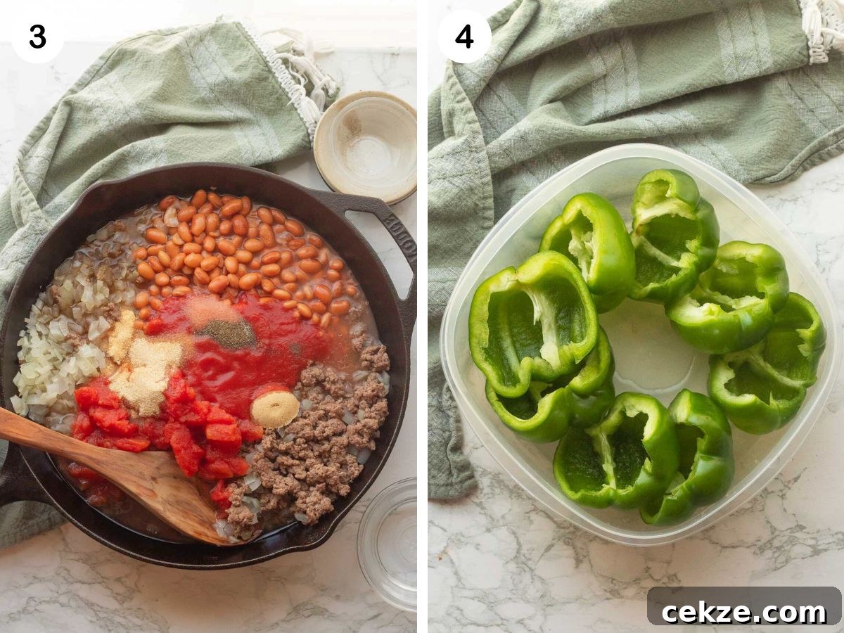 Cooked ground beef and onions with spices, beans, and tomatoes in black skillet. Green pepper halves in plastic