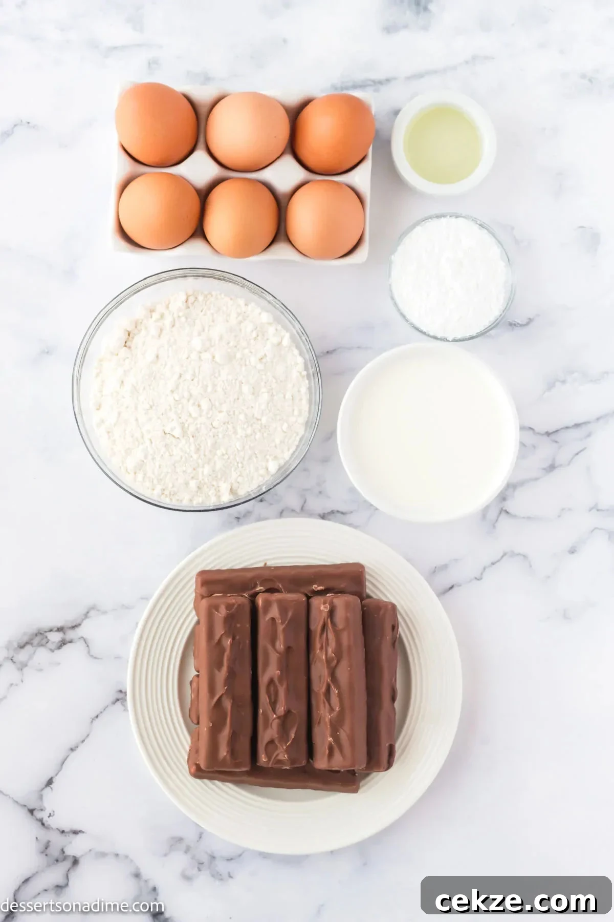 Crispy Deep-Fried Snickers: How to Make the Perfect Indulgent Treat 3 Ingredients for Deep Fried Snickers - Snickers Bars, pancake batter, eggs, oil and powdered sugar.