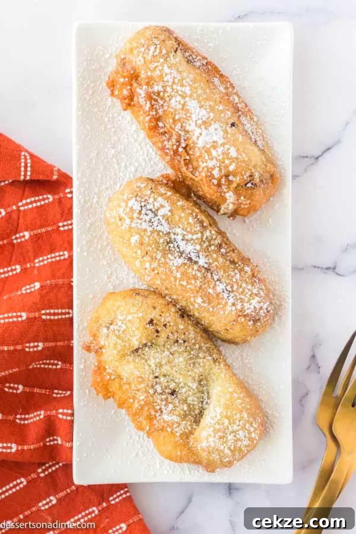 Crispy Deep-Fried Snickers: How to Make the Perfect Indulgent Treat 10 Deep fried snickers on a platter.
