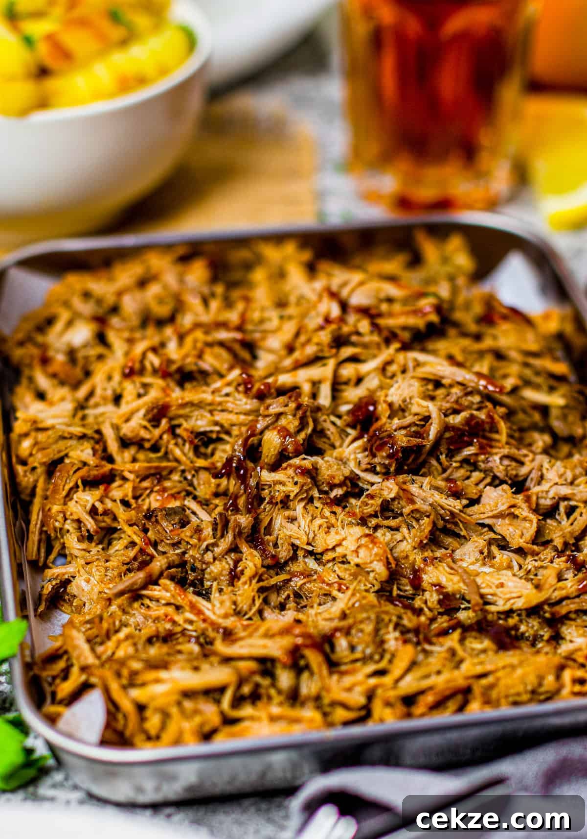Tender Slow Cooker Pulled Pork Recipe for Sandwiches 6 Close up of Pulled Pork on try