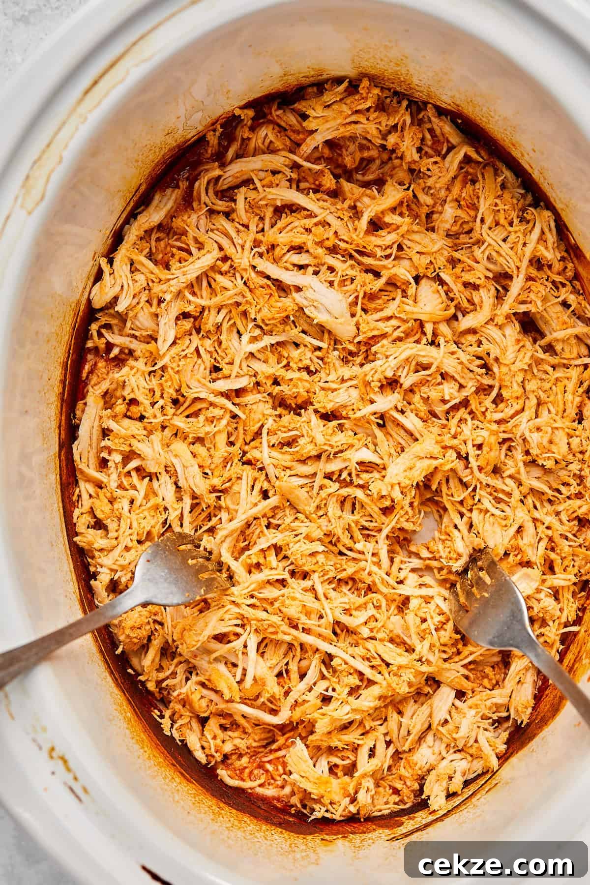 shredding chicken with 2 forks